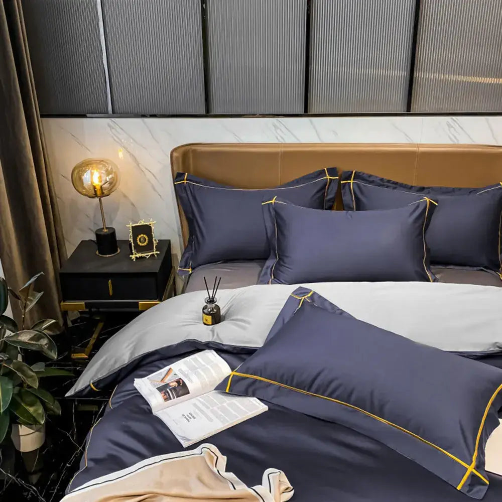 Navy blue satin pillowcases with gold piping accents from decorbites luxurious egyptian cotton bedding set