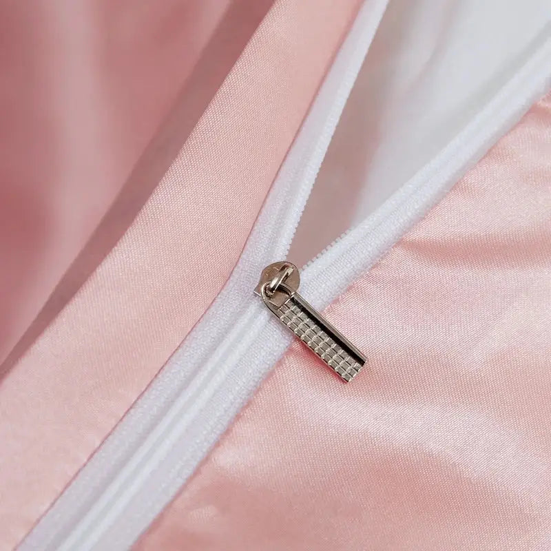 Silver-toned zipper pull with textured pattern on soft pink rayon satin solid color bedding set pcduvet cover width bed