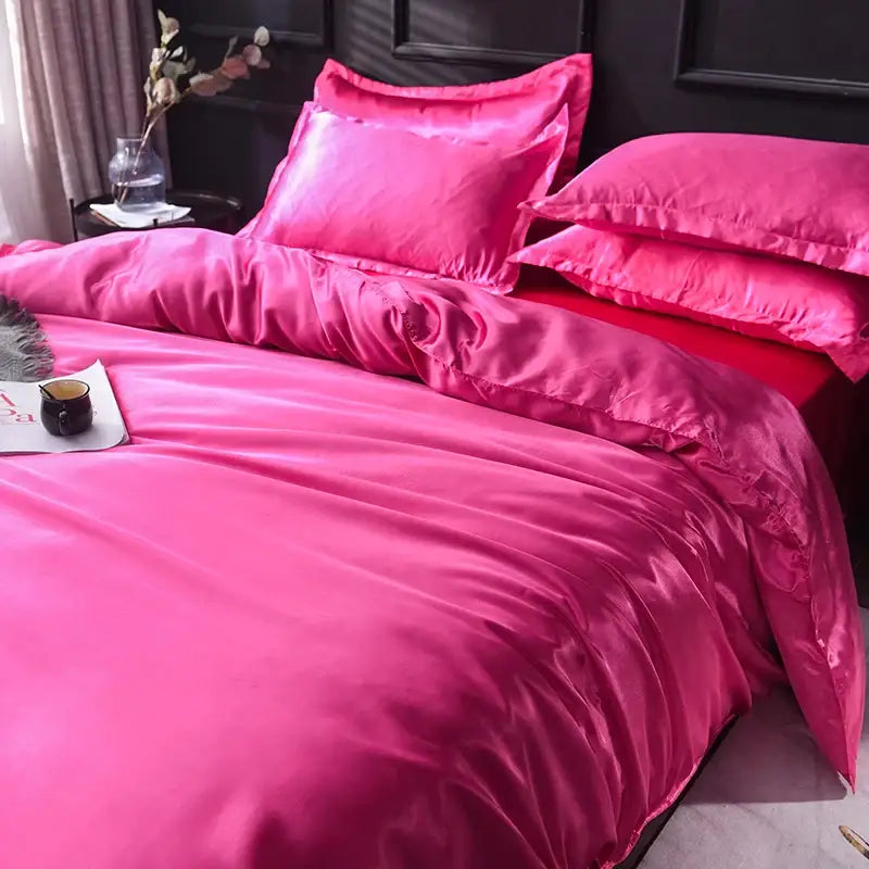 Vibrant fuchsia decorbites™ luxurious silk bedding set featuring glossy smooth texture and matching pillowcases