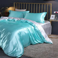 Turquoise satin duvet cover set with pcs duvet cover and matching pillowcases featuring luxurious sheen by DecorBites