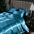Teal satin silk bedding set with glossy finish and matching pillowcases from decorbites luxurious silk bedding set