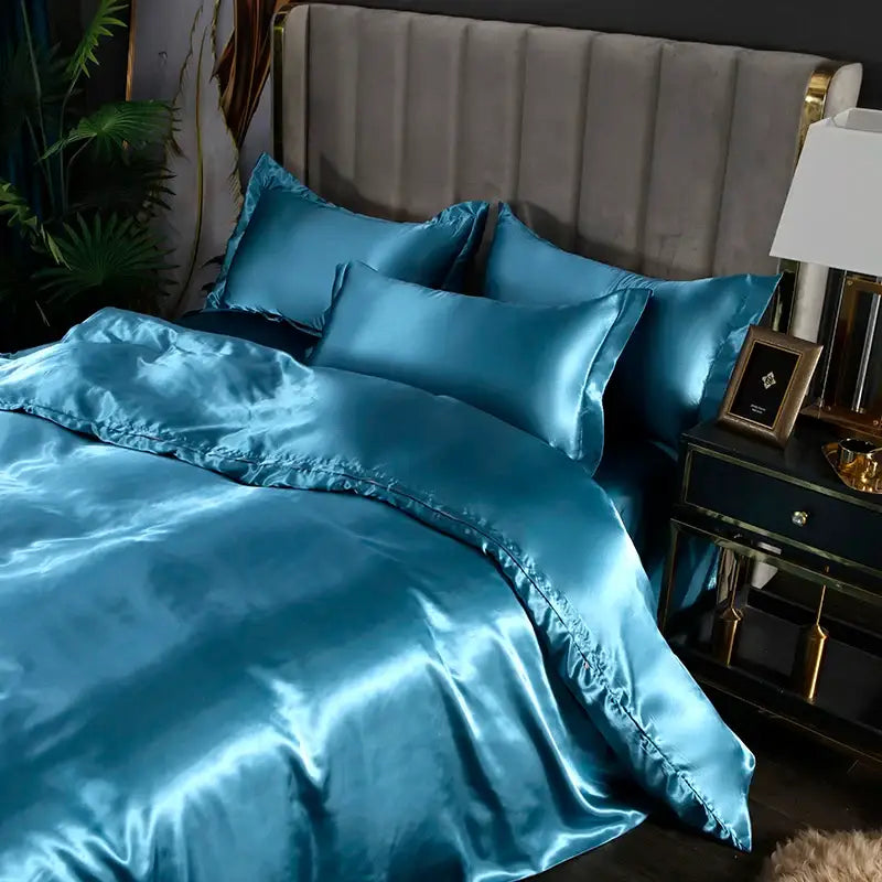 Teal satin silk bedding set with glossy finish and matching pillowcases from decorbites™ luxurious silk bedding set