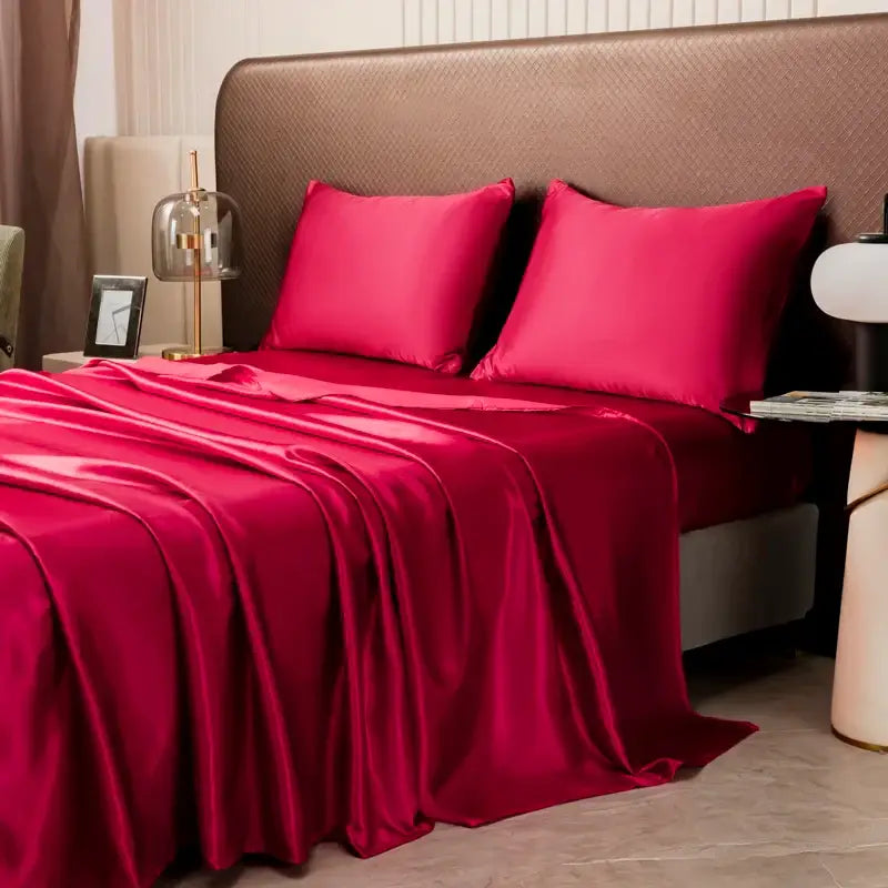 Vibrant red satin bedding set by DecorBites™ featuring a solid color flat sheet with a smooth lustrous finish