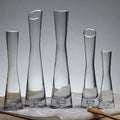 Set of five clear DecorBites™ luxury glass flower vases with slender necks and flared bases for home decor