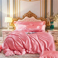 Pink satin bedding set with matching quilt and pillows featuring ornate gold headboard in decorbites mulberry silk
