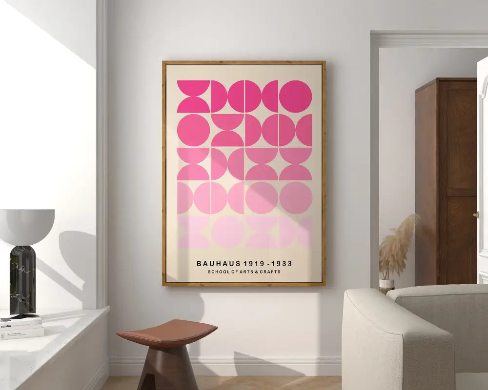 A framed bauhaus mid century canvas print featuring pink geometric circles on off white background for home decor