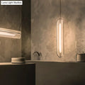 DecorBites minimalist hanging lamp with clear acrylic shade and acrylic pipe features a sleek translucent body and warm glow