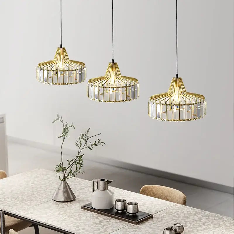 Three elegant gold-toned pendant lamps with crystal glass accents from decorbites™ nordic led crystal chandelier