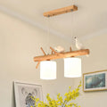 DecorBites™ modern branch island pendant light with wood fixture, cream glass shades, and bird accents for dining room ceiling