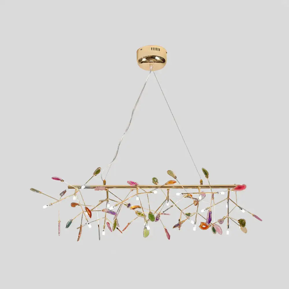 Decorbites modern colorful island light fixture with gold-toned bar and translucent glass leaves for warm color temperature lighting