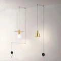 Two minimalist brass pendant lights with geometric designs hanging from black cords in decorbites™ modern diy pendant light