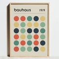 A minimalist framed decorbites modern geometric bauhaus canvas wall art with colorful circles and bauhaus logo