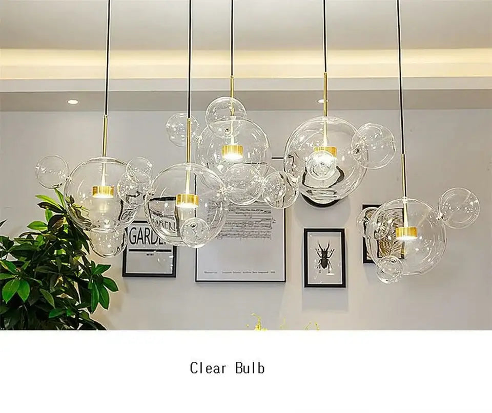 Clear glass bubble pendant lights with gold-toned fixtures in decorbites modern led bubble ball chandelier for living room