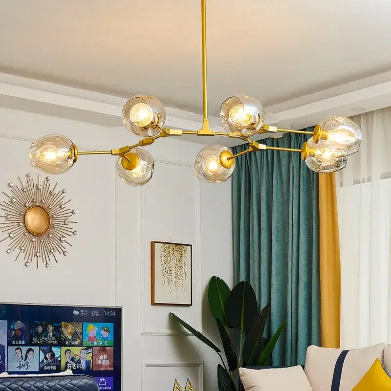 Gold-toned DecorBites™ modern nordic glass ball led chandelier with multiple spherical glass bulbs in a ball led chandelier design