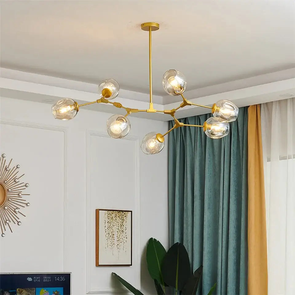 Gold-toned DecorBites™ modern nordic glass ball led chandelier with clear glass globe bulbs and branching metal frame