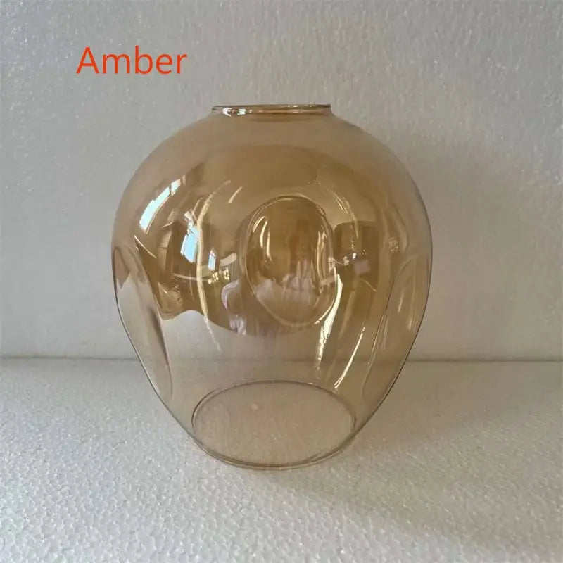 Amber-colored glass chandelier lampshade with smooth rounded dome and subtle internal ridges in DecorBites™ modern nordic glass design