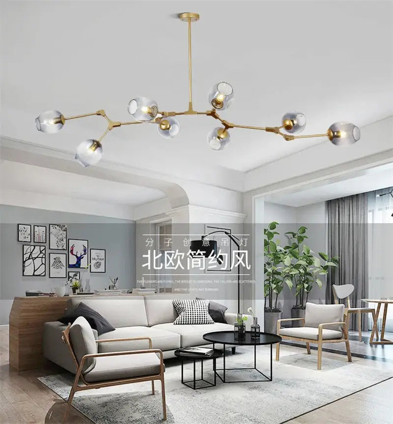 Gold-toned modern nordic glass chandelier with clear glass globe shades from decorbites nordic lustre collection