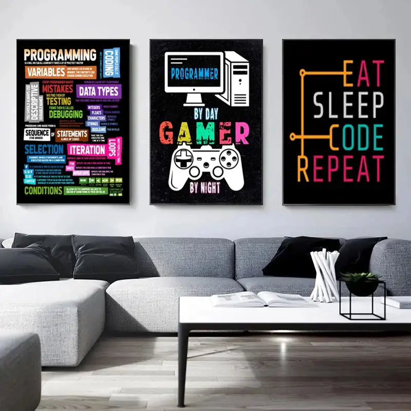Three framed vibrant programmer gamer wall art posters with colorful text above a gray sectional sofa by decorbites