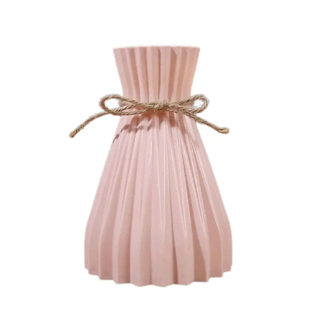 A blush pink pleated ceramic flower vase with a rustic twine bow for modern simple dry flowers by DecorBites™