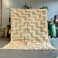 Beige and cream geometric patterned moroccan handmade beni ouarain wool rug with fringed edges 3m x 2m