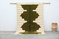 Cream-colored DecorBites™ moroccan handmade traditional azilal rug with bold green geometric pattern and textured woven surface