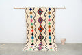 Beige moroccan handmade traditional azilal rug with colorful geometric patterns and fringed edges 255 x 144 cm