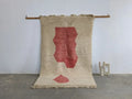 Beige woven moroccan handmade traditional azilal rug with bold red abstract leaf design and fringed edges 255 x 155 cm