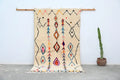 Beige DecorBites™ moroccan handmade traditional azilal rug with colorful black orange pink and blue geometric patterns 260 x 145 cm