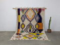 Decorbites moroccan handmade traditional azilal rug with cream base and bold yellow orange blue pink green geometric patterns