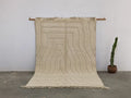 Beige moroccan handmade beni ouarain rug with geometric pattern and fringed edges 300 x 200 cm from DecorBites