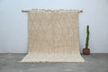 Beige moroccan handmade beni ouarain rug with geometric diamond pattern and fringed edges 300 x 211 cm