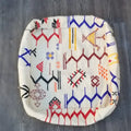 A decorbites moroccan handmade 60cm x 60cm off-white cushion with vibrant embroidered geometric patterns