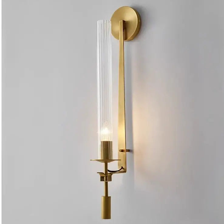 Decorbites™ moroccan wall sconce with a gold tone, ribbed glass cylinder, and slender metal arm modern gold wall sconces