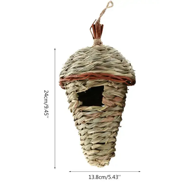 Handwoven natural grass acorn-shaped bird cage with reddish-brown band and twine loop for outdoor style birds nest decor