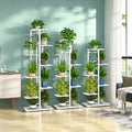 White natural iron plant stand with multiple tiers holding potted green plants in colorful pots DecorBites iron plant stand