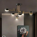 Modern black and gold geometric pendant light with cylindrical fixtures ideal for nordic black gold living room decor