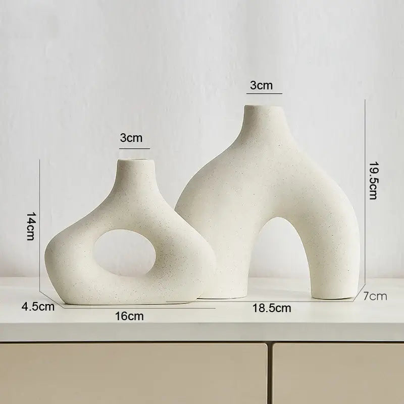 Cream-colored nordic ceramic vases home decor with organic sculptural forms and a matte finish by decorbites