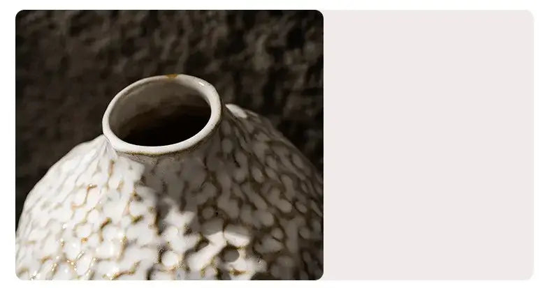 DecorBites™ nordic ceramic vase with a textured pebbled surface and subtle gold accents holding pampas grass