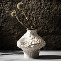 White ceramic nordic ceramic vase by DecorBites with a textured organic surface and bulbous shape displayed with pampas grass
