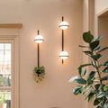 Three decorbites™ nordic planter light sconces with black metal rods and frosted glass globes for stylish lighting