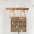 Rustic wooden beam nordic style pendant light with two woven bamboo pear-shaped shades and white ceramic bird decor