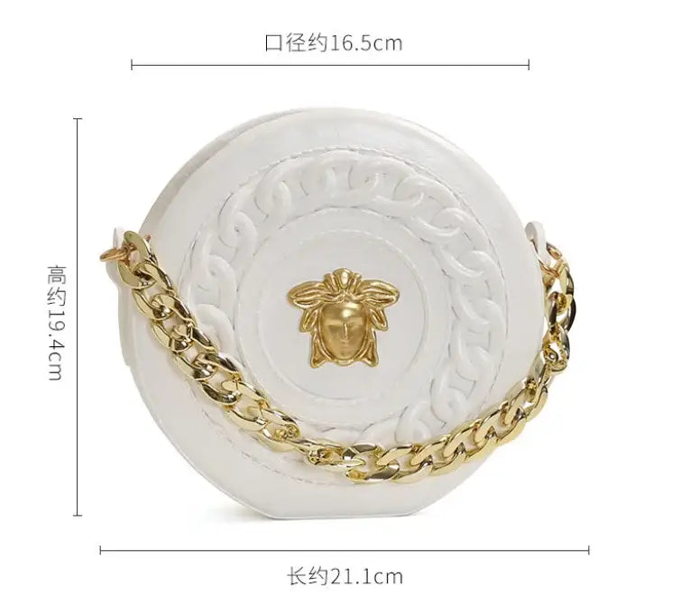 White circular handbag with gold-tone chain strap and embossed medusa head emblem in nordic style half face design