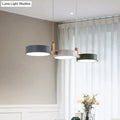 Modern three-light dining room pendant with matte gray, white, and dark green acrylic shades, bulb included, white warm light