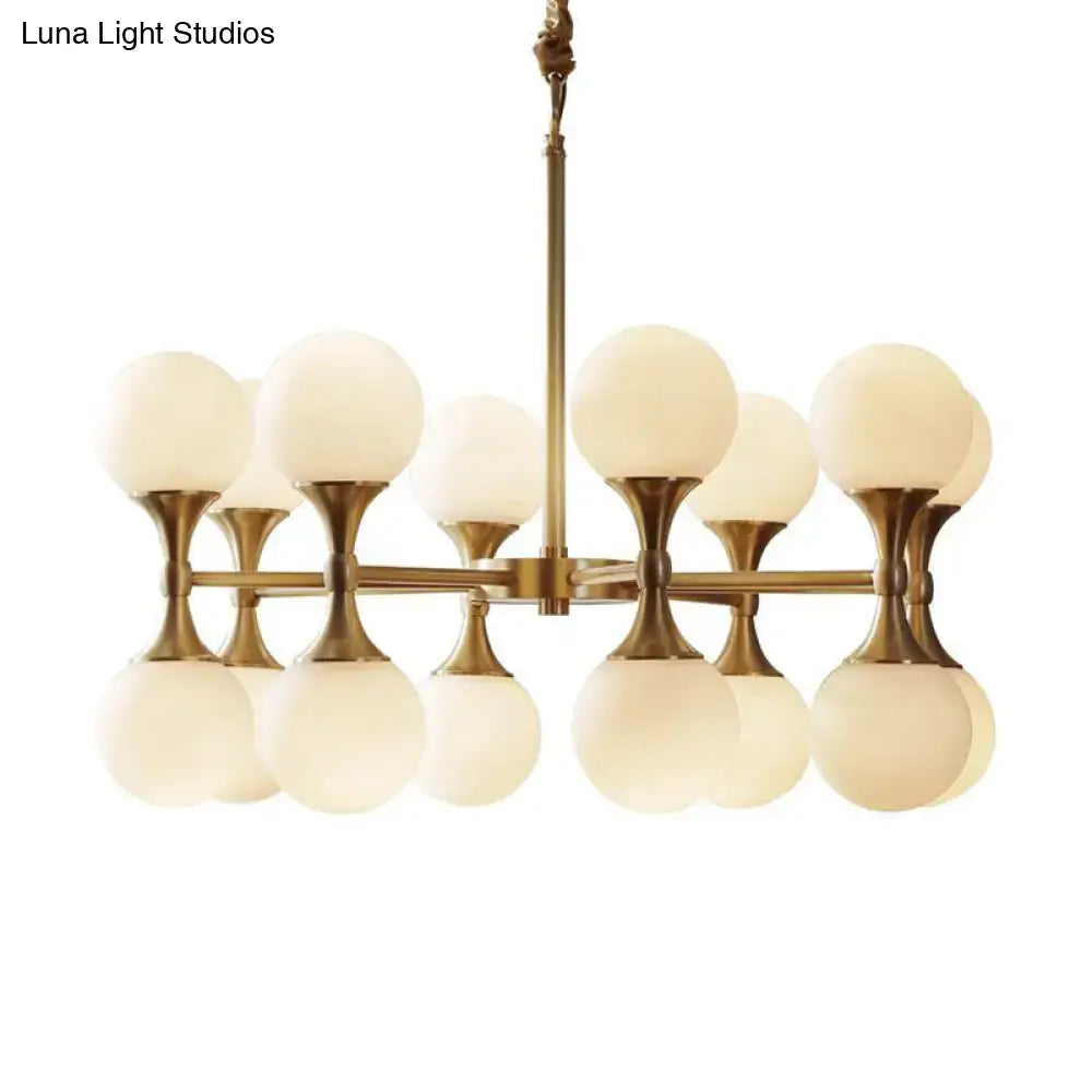 Decorbites opal glass chandelier light with 12 brass globe heads and frosted opal glass shades in brass finish