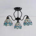 Stylish DecorBites™ peacock stained glass semi flush light with black metal frame and three blue teal shades