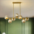 DecorBites™ Postmodern Gold Finish Amber Glass Ball Island Hanging Lamp for Table Illumination