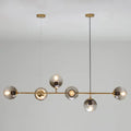 Modern brass pendant light with five smoked glass globes from decorbites™ postmodern gold island pendant set with e26 e27 bulbs
