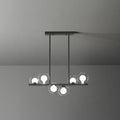 Modern black metal light fixture with five clear glass globe bulbs decorbites postmodern led island light