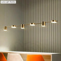 Modern gold-toned decorbites™ postmodern straight bar led ceiling light with five cylindrical bulbs for kitchen island