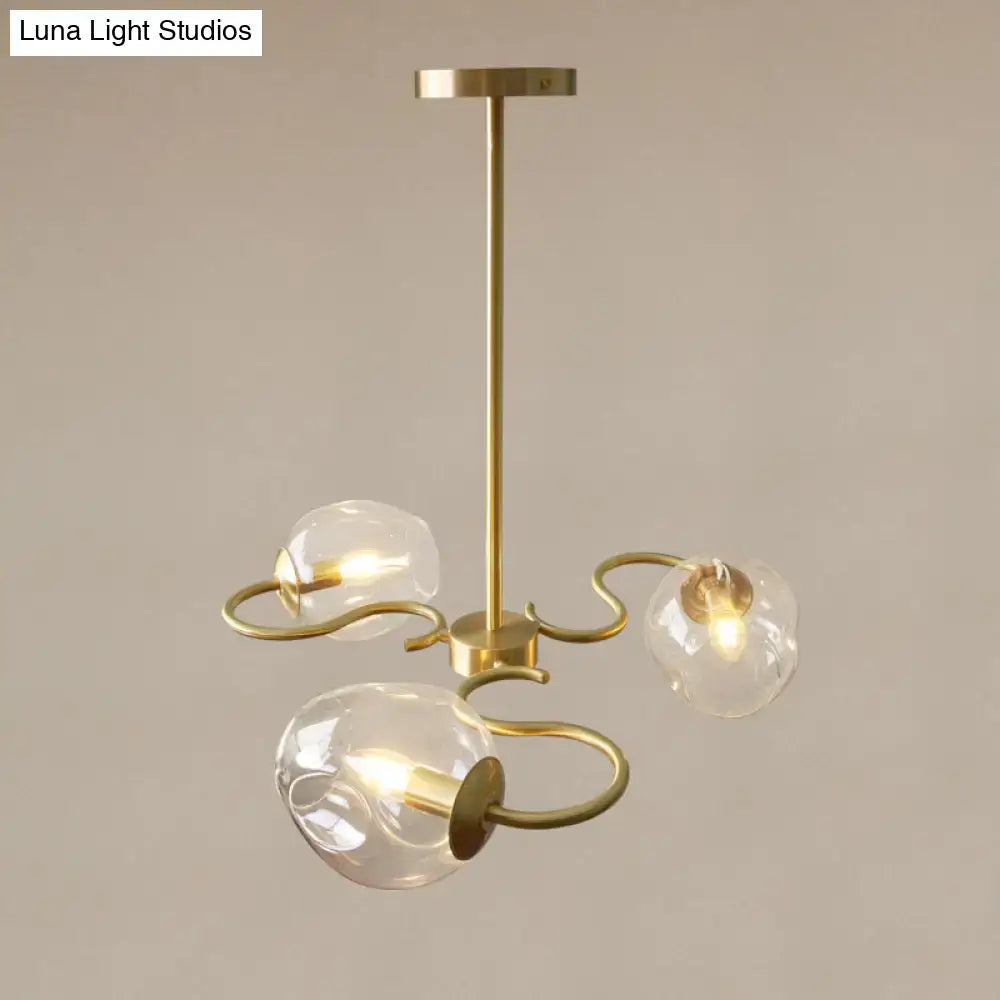 Brass finished semi-flush mount chandelier with three clear glass globes and curved organic arms for bedroom e12 e14